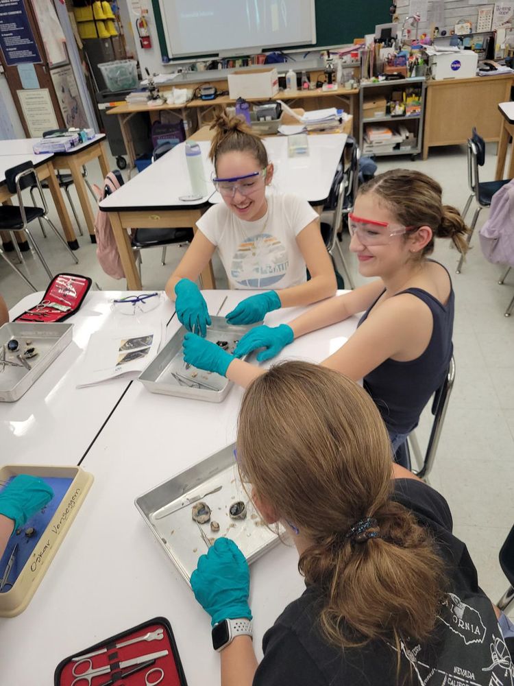 Students with dissection kits at a classroom table
